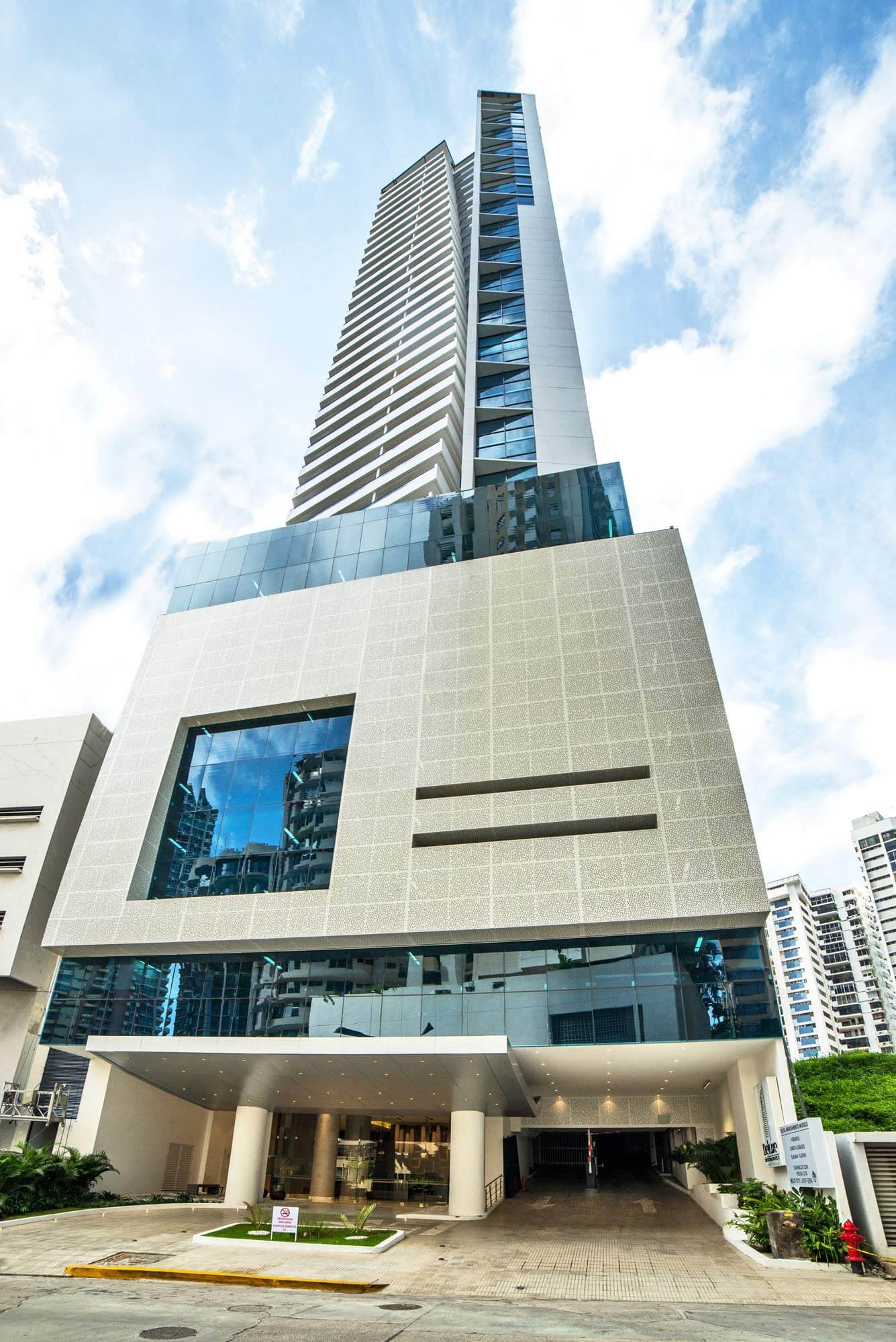 Deluxe Residences — exterior photograph of the completed tower and entrance